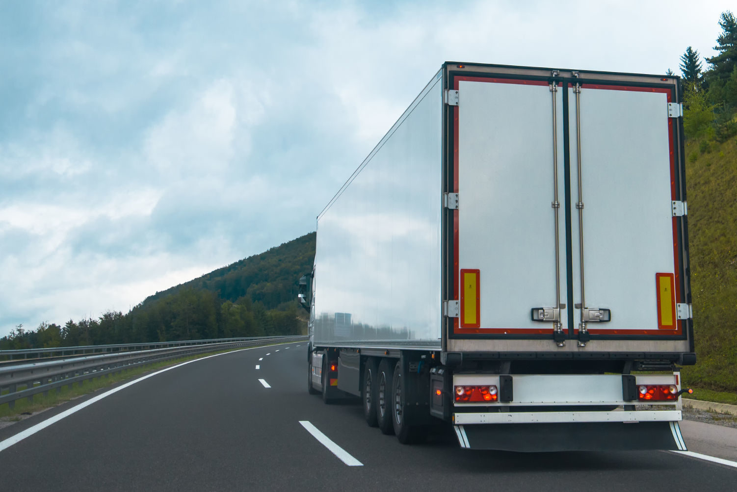 Semi truck with trailer on highway road