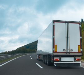 Semi truck with trailer on highway road